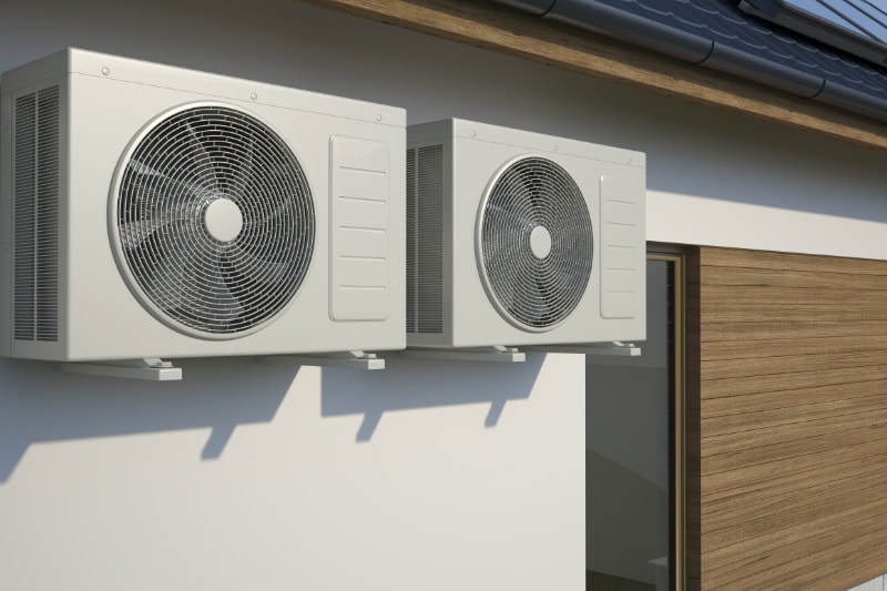 outdoor air conditioner unit attached to a building.